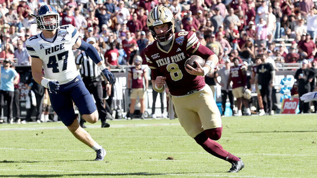 FORT WORTH, TEXAS - JANUARY 02: Brad Jackson #8 of the Texas State Bobcats scores a touchdown against the Rice Owls during the first half of the 2026 Lockheed Martin Armed Forces Bowl at Amon G. Carter Stadium on January 02, 2026 in Fort Worth, Texas.