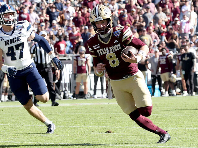 FORT WORTH, TEXAS - JANUARY 02: Brad Jackson #8 of the Texas State Bobcats scores a touchdown against the Rice Owls during the first half of the 2026 Lockheed Martin Armed Forces Bowl at Amon G. Carter Stadium on January 02, 2026 in Fort Worth, Texas.