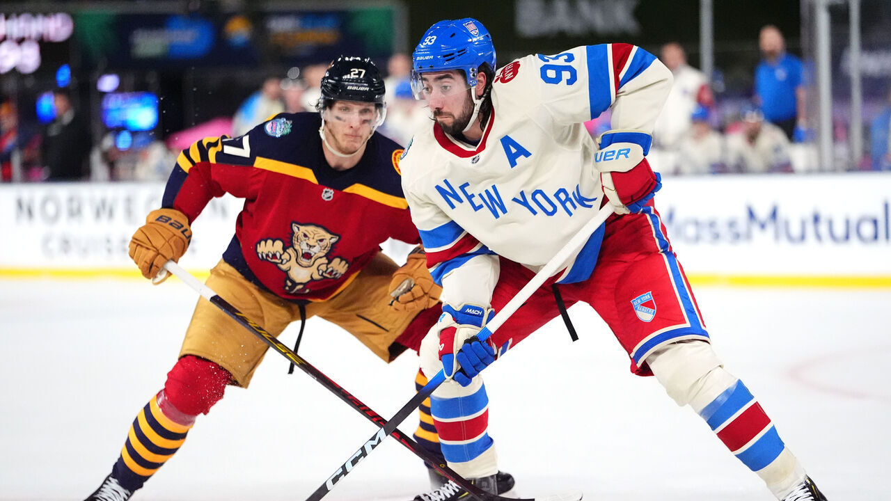 MIAMI, FLORIDA - JANUARY 02: Mika Zibanejad #93 of the New York Rangers and Eetu Luostarinen #27 of the Florida Panthers skate for position during the third period of the 2026 Discover NHL Winter Classic game between the New York Rangers and the Florida Panthers at loanDepot park on January 02, 2026 in Miami, Florida.