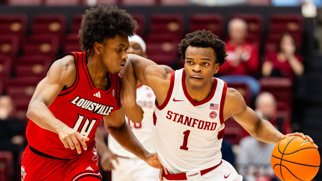 STANFORD, CA - JANUARY 02: Ebuka Okorie #1 of the Stanford Cardinal dribbles against Adrian Wooley #14 of the Louisville Cardinals during a game on January 2, 2026 at Maples Pavilion in Stanford, CA.