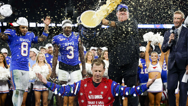 San Diego, California - January 02: Actor Brian Baumgartner tosses eggnog over Rhett Lashlee of SMU after the Mustangs defeated Arizona during the Holiday Bowl at Snapdragon Stadium on Friday, Jan. 2, 2026 in San Diego, California.