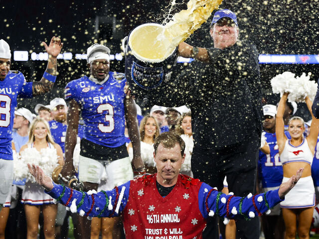 San Diego, California - January 02: Actor Brian Baumgartner tosses eggnog over Rhett Lashlee of SMU after the Mustangs defeated Arizona during the Holiday Bowl at Snapdragon Stadium on Friday, Jan. 2, 2026 in San Diego, California.