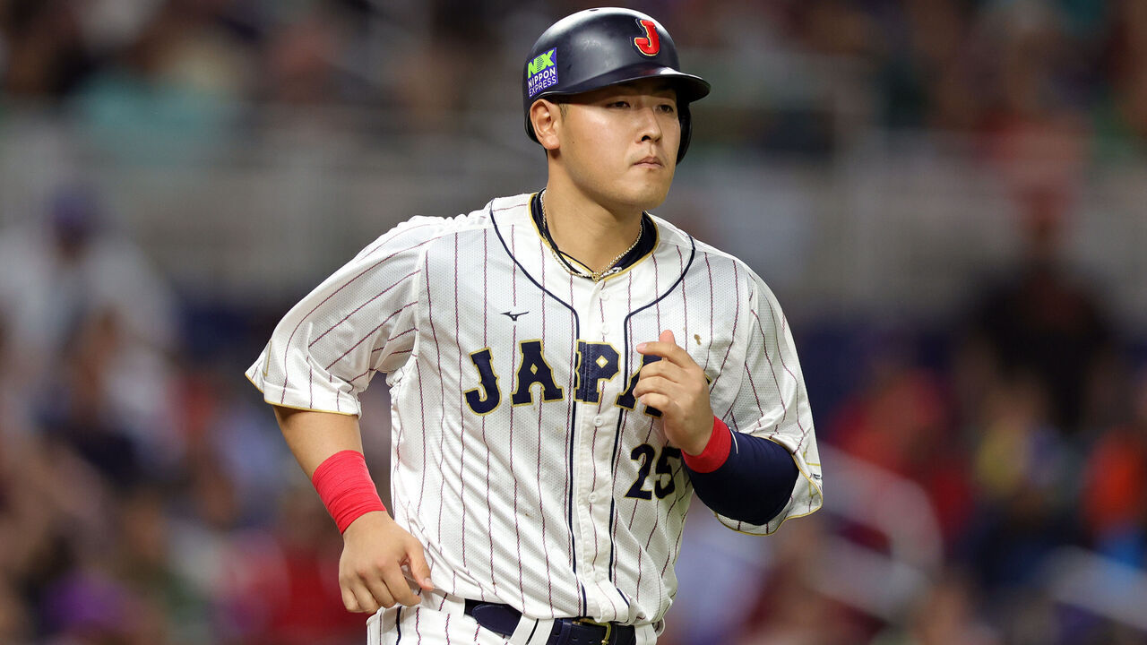 MIAMI, FLORIDA - MARCH 20: Kazuma Okamoto #25 of Team Japan runs to first base after being walked during the sixth inning against Team Mexico during the World Baseball Classic Semifinals at loanDepot park on March 20, 2023 in Miami, Florida.
