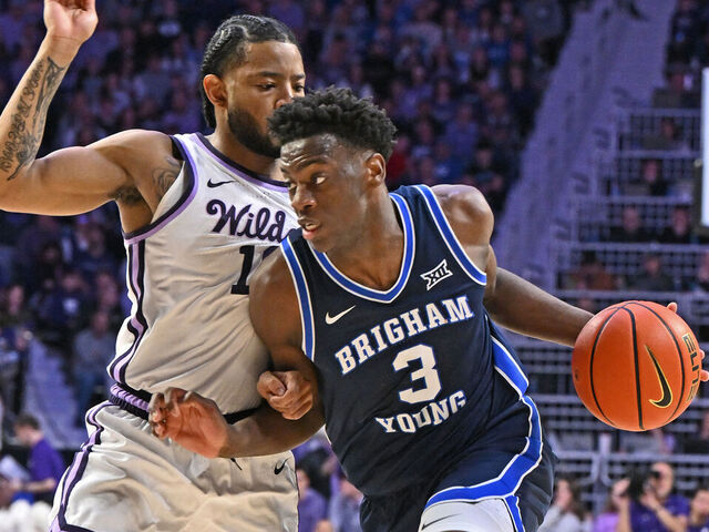 MANHATTAN, KS - JANUARY 03: AJ Dybantsa #3 of the BYU Cougars dribbles against pressure from David Castillo #10 of the Kansas State Wildcats in the second half at Bramlage Coliseum on January 3, 2026 in Manhattan, Kansas.