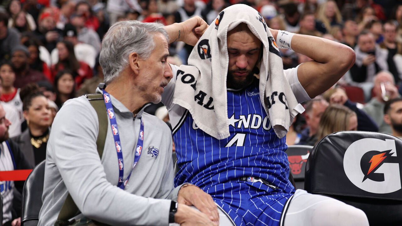 CHICAGO, ILLINOIS - JANUARY 2: Jalen Suggs #4 of the Orlando Magic receives treatment after leaving the court with an injury during the second half against the Chicago Bulls at the United Center on January 2, 2026 in Chicago, Illinois.