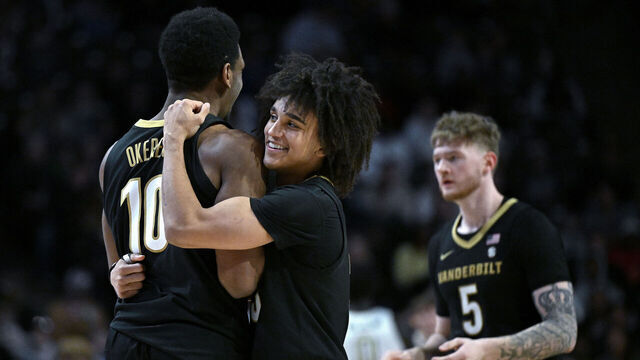 WINSTON SALEM, NORTH CAROLINA - DECEMBER 21: Tyler Tanner #3 of the Vanderbilt Commodores embraces Ak Okereke #10 during the second half of the game against the Wake Forest Demon Deacons at Lawrence Joel Veterans Memorial Coliseum on December 21, 2025 in Winston Salem, North Carolina.