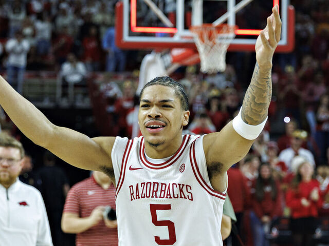 FAYETTEVILLE, ARKANSAS - JANUARY 03: Darius Acuff Jr. #5 of the Arkansas Razorbacks celebrates with the fans after the game against the Tennessee Volunteers at Bud Walton Arena on January 03, 2026 in Fayetteville, Arkansas. The Razorbacks defeated the Volunteers 86-75.