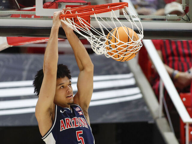 SALT LAKE CITY, UT - JANUARY 3: Brayden Burries #5 of the Arizona Wildcats dunks the ball agaisnt the Utah Utes during the second half of their game at the Jon M Huntsman Center on January 3, 2026 in Salt Lake City, Utah.