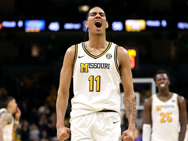 COLUMBIA, MISSOURI - JANUARY 03: Trent Pierce #11 of the Missouri Tigers reacts after scoring during the game against the Florida Gators at Mizzou Arena on January 03, 2026 in Columbia, Missouri.