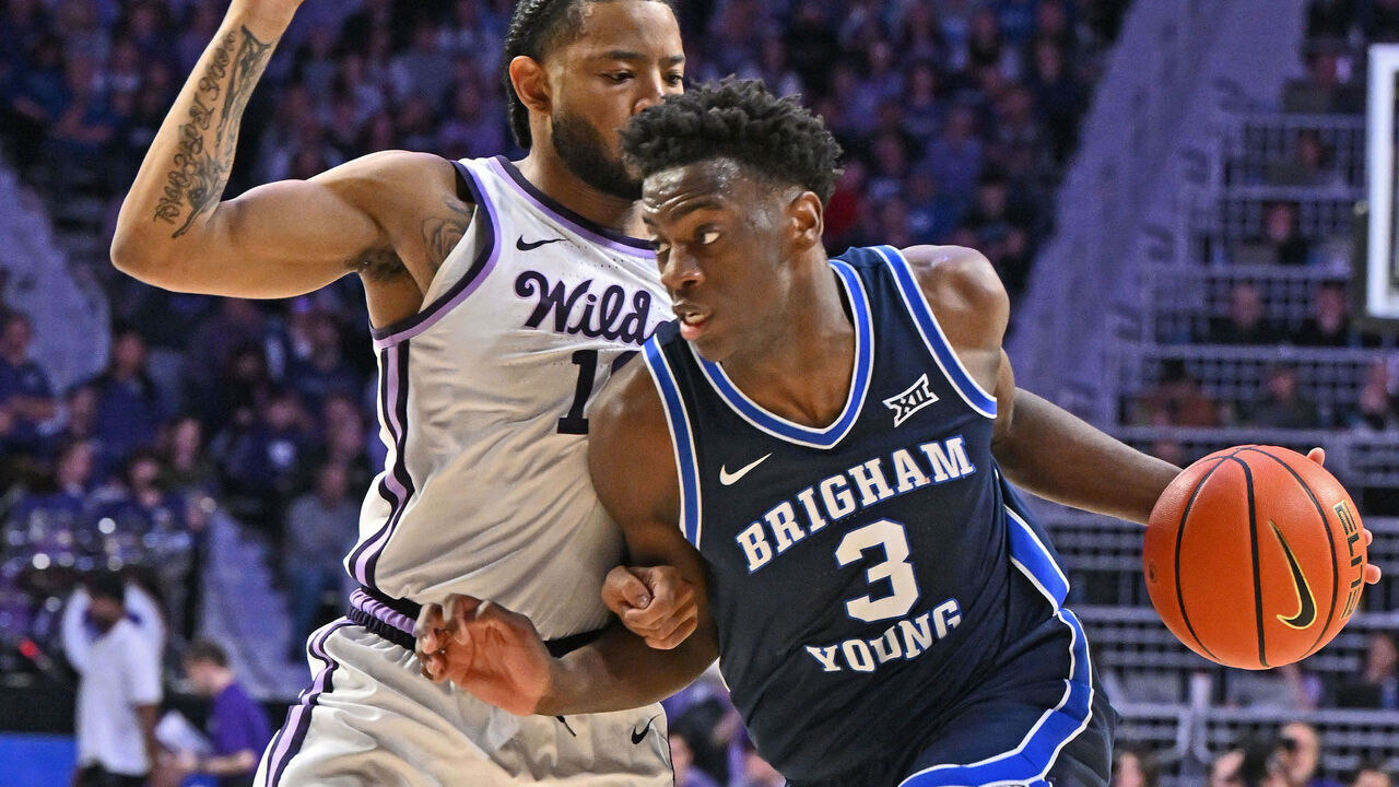 MANHATTAN, KS - JANUARY 03: AJ Dybantsa #3 of the BYU Cougars dribbles against pressure from David Castillo #10 of the Kansas State Wildcats in the second half at Bramlage Coliseum on January 3, 2026 in Manhattan, Kansas.