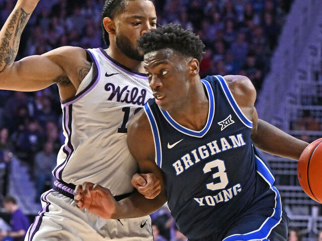 MANHATTAN, KS - JANUARY 03: AJ Dybantsa #3 of the BYU Cougars dribbles against pressure from David Castillo #10 of the Kansas State Wildcats in the second half at Bramlage Coliseum on January 3, 2026 in Manhattan, Kansas.