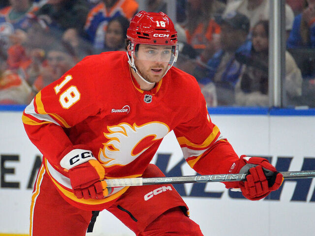 EDMONTON, CANADA - DECEMBER 23: John Beecher #18 of the Calgary Flames in action during the game against the Edmonton Oilers at Rogers Place on December 23, 2025, in Edmonton, Alberta, Canada.