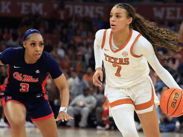 AUSTIN, TX - JANUARY 04: Texas Longhorns guard Jordan Lee (7) dribbles pas Ole Miss Rebels guard Kaitlin Peterson (3) during the game on January 04, 2026, at the Moody Center in Austin, TX.