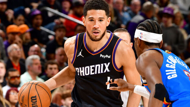 PHOENIX, AZ - JANUARY 4: Devin Booker #1 of the Phoenix Suns handles the ball during the game against the Oklahoma City Thunder on January 4, 2026 at PHX Arena in Phoenix, Arizona. Mandatory Copyright Notice: Copyright 2026 NBAE