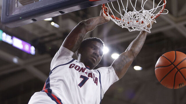 SPOKANE, WA - JANUARY 04: Gonzaga Bulldogs guard Tyon Grant-Foster (7) hangs on the rim after dunking the ball during the game between the Loyola Marymount Lions and the Gonzaga Bulldogs at McCarthy Athletic Center in Spokane, WA, on January 4, 2026.