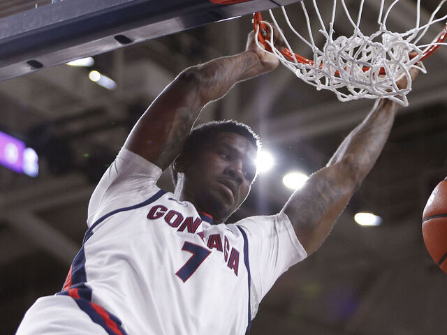 SPOKANE, WA - JANUARY 04: Gonzaga Bulldogs guard Tyon Grant-Foster (7) hangs on the rim after dunking the ball during the game between the Loyola Marymount Lions and the Gonzaga Bulldogs at McCarthy Athletic Center in Spokane, WA, on January 4, 2026.
