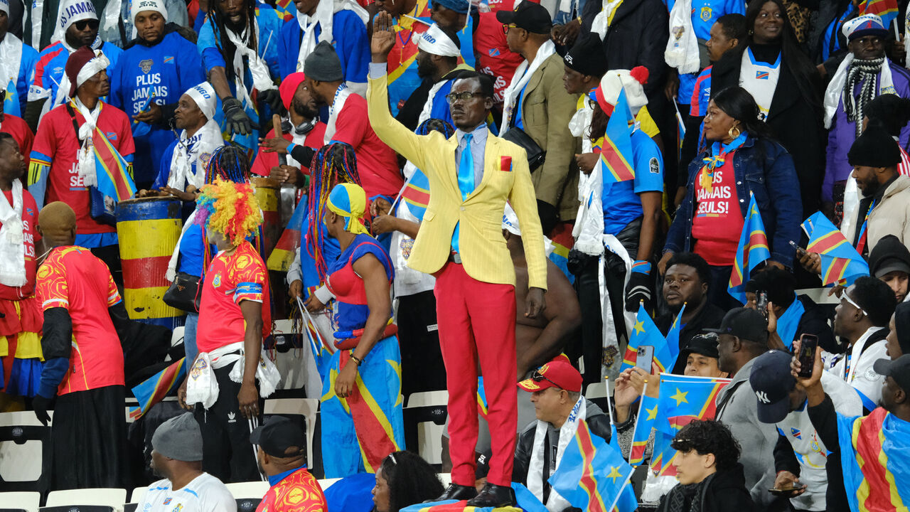RABAT, MOROCCO â" DECEMBER 30: Congolese superfan and entertainer âLumumbaâ stands throughout the match with his arm raised, passionately supporting DR Congo during the 35th Africa Cup of Nations (AFCON 2025) Group D match against Botswana at Agdal Medina Stadium in Rabat, Morocco, on December 30, 2025, as he aims to set a new personal record.
