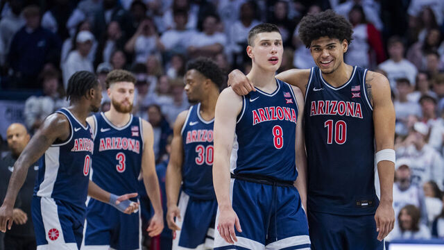 STORRS, CONNECTICUT - NOVEMBER 19: Ivan Kharchenkov #8 and Koa Peat #10 of the Arizona Wildcats react during the second half of an NCAA men's basketball game against the Connecticut Huskies at Harry A. Gampel Pavilion on November 19, 2025 in Storrs, Connecticut.