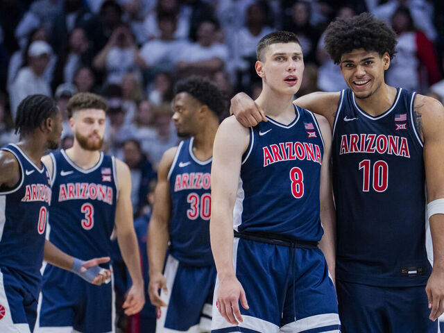 STORRS, CONNECTICUT - NOVEMBER 19: Ivan Kharchenkov #8 and Koa Peat #10 of the Arizona Wildcats react during the second half of an NCAA men's basketball game against the Connecticut Huskies at Harry A. Gampel Pavilion on November 19, 2025 in Storrs, Connecticut.