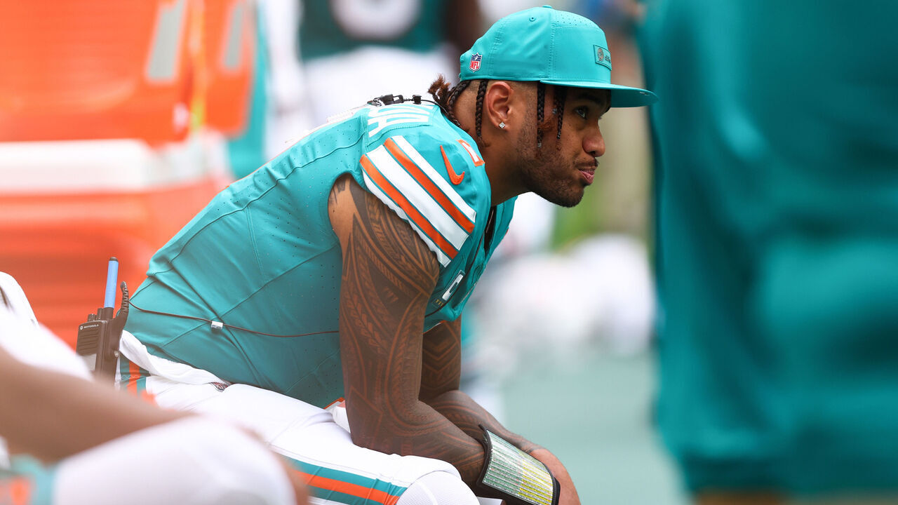 MIAMI GARDENS, FLORIDA - DECEMBER 21: Tua Tagovailoa #1 of the Miami Dolphins looks on during the second half of the game against the Cincinnati Bengals at Hard Rock Stadium on December 21, 2025 in Miami Gardens, Florida.