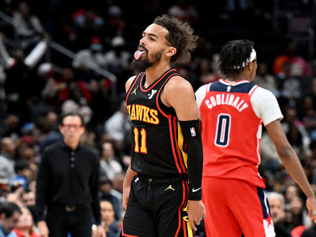 WASHINGTON, DC - FEBRUARY 08: Trae Young #11 of the Atlanta Hawks celebrates after scoring in the second quarter against the Washington Wizards at Capital One Arena on February 08, 2025 in Washington, DC.