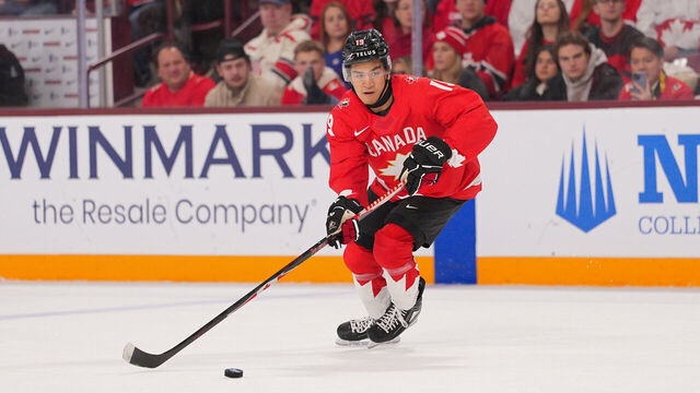 MINNEAPOLIS, MINNESOTA - DECEMBER 31: Zayne Parekh #19 of team Canada skates with the puck against the Finland in the first period of a Group B stage game during the 2026 IIHF World Junior Championship at Mariucci Arena on December 31, 2025 in Minneapolis, Minnesota.
