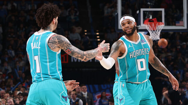 OKLAHOMA CITY, OK - JANUARY 5: LaMelo Ball #1 and Miles Bridges #0 of the Charlotte Hornets high five during the game against the Oklahoma City Thunder on January 5, 2026 at Paycom Center in Oklahoma City, Oklahoma. Mandatory Copyright Notice: Copyright 2025 NBAE