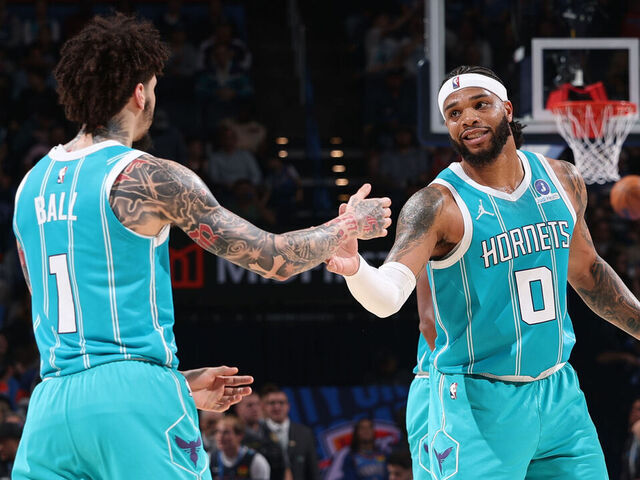 OKLAHOMA CITY, OK - JANUARY 5: LaMelo Ball #1 and Miles Bridges #0 of the Charlotte Hornets high five during the game against the Oklahoma City Thunder on January 5, 2026 at Paycom Center in Oklahoma City, Oklahoma. Mandatory Copyright Notice: Copyright 2025 NBAE
