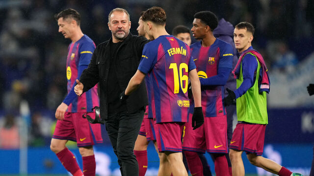 BARCELONA, SPAIN - JANUARY 03: Hansi Flick, Head Coach of FC Barcelona, and Fermin Lopez celebrate after the LaLiga EA Sports match between RCD Espanyol de Barcelona and FC Barcelona at RCDE Stadium on January 03, 2026 in Barcelona, Spain.