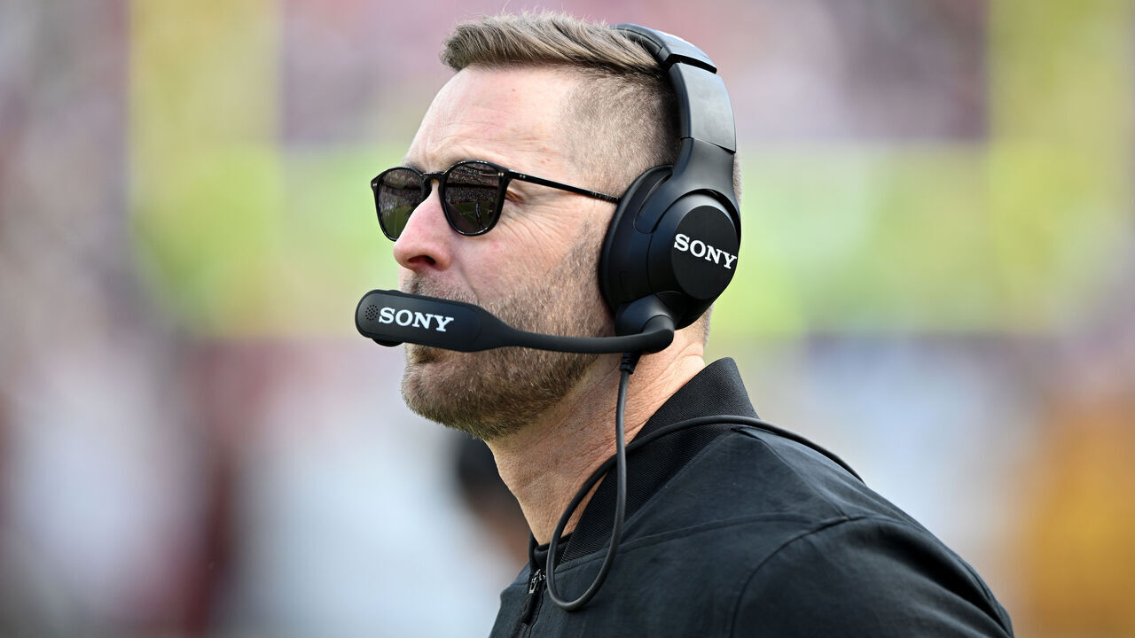 LANDOVER, MARYLAND - DECEMBER 25: Offensive coordinator Kliff Kingsbury of the Washington Commanders looks on in the first quarter of a game against the Dallas Cowboys at Northwest Stadium on December 25, 2025 in Landover, Maryland.