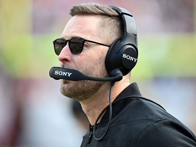 LANDOVER, MARYLAND - DECEMBER 25: Offensive coordinator Kliff Kingsbury of the Washington Commanders looks on in the first quarter of a game against the Dallas Cowboys at Northwest Stadium on December 25, 2025 in Landover, Maryland.