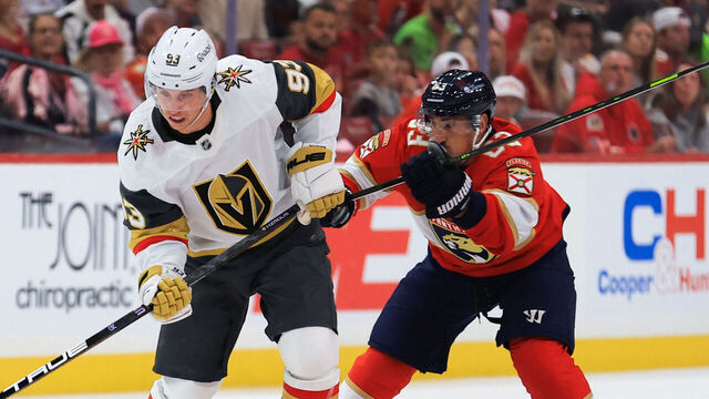 SUNRISE, FLORIDA - OCTOBER 25: Mitch Marner #93 of the Vegas Golden Knights plays the puck in the neutral zone against Brad Marchand #63 of the Florida Panthers during the first period of the game at Amerant Bank Arena on October 25, 2025 in Sunrise, Florida.
