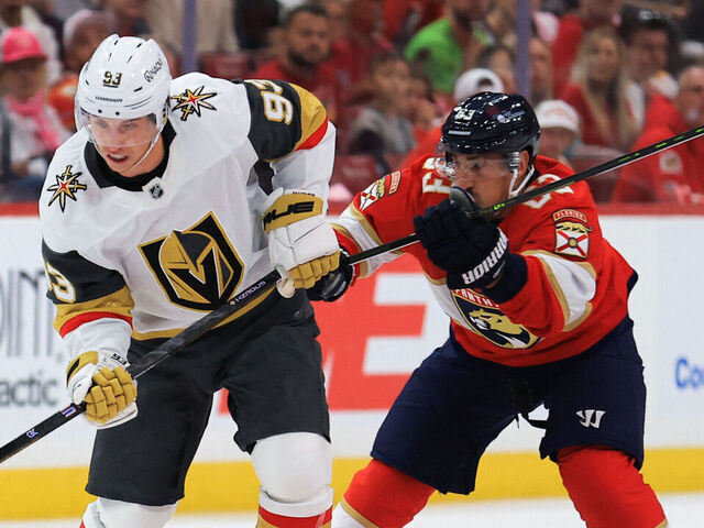 SUNRISE, FLORIDA - OCTOBER 25: Mitch Marner #93 of the Vegas Golden Knights plays the puck in the neutral zone against Brad Marchand #63 of the Florida Panthers during the first period of the game at Amerant Bank Arena on October 25, 2025 in Sunrise, Florida.