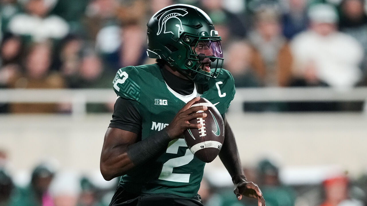 EAST LANSING, MICHIGAN - OCTOBER 25: Aidan Chiles #2 of the Michigan State Spartans runs in action and looks to pass the ball against the Michigan Wolverines at Spartan Stadium on October 25, 2025 in East Lansing, Michigan.