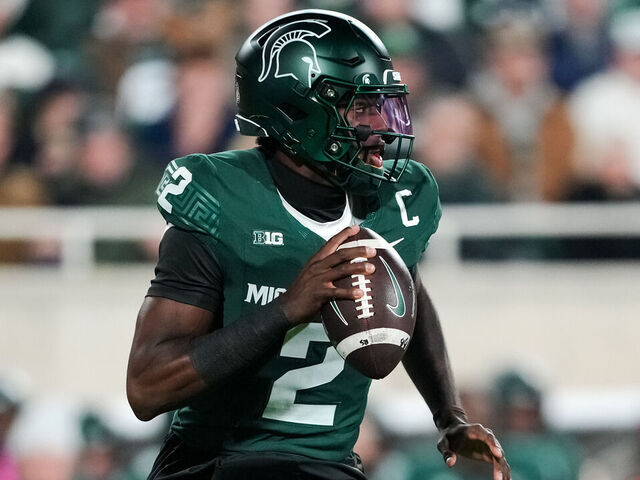 EAST LANSING, MICHIGAN - OCTOBER 25: Aidan Chiles #2 of the Michigan State Spartans runs in action and looks to pass the ball against the Michigan Wolverines at Spartan Stadium on October 25, 2025 in East Lansing, Michigan.