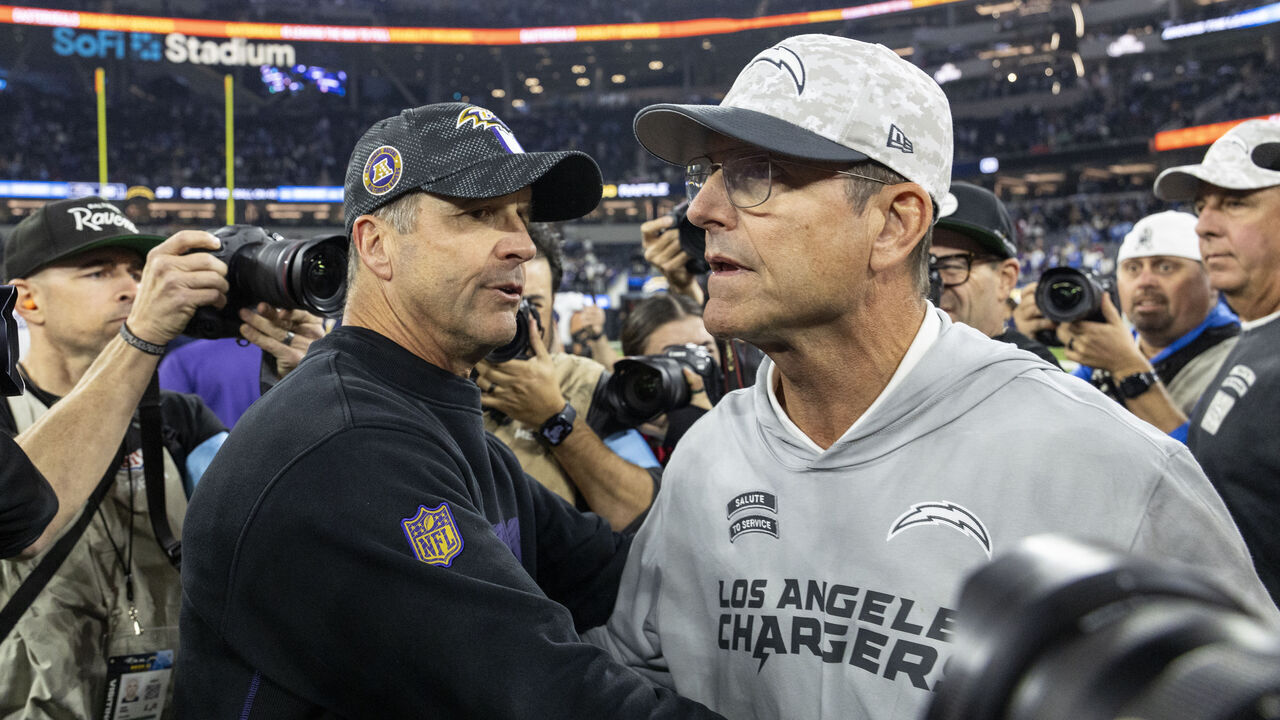 INGLEWOOD, CALIFORINA - NOVEMBER 25: Head coach John Harbaugh of the Baltimore Ravens and Head coach Jim Harbaugh of the Los Angeles meet following an NFL Football game at SoFi Stadium on November 25, 2024 in Inglewood, Califorina.