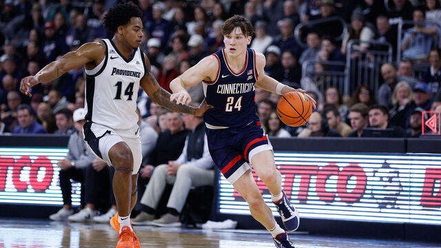 PROVIDENCE, RI - JANUARY 07: Braylon Mullins #24 of the UConn Huskies drives to the basket against Jr. Corey Floyd #14 of the Providence Friars during the college basketball game between UConn Huskies and Providence Friars on January 7, 2026, at Amica Mutual Pavilion in Providence, RI.