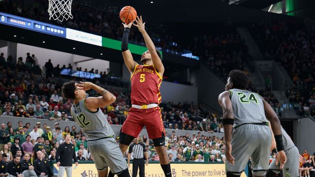 WACO, CA - JANUARY 07: Forward Joshua Jefferson #5 of the Iowa State Cyclones takes a shot over guard Michael Rataj #12 of the Baylor Bears during the Big 12 college basketball game between Baylor Bears and Iowa State Cyclones on January 7, 2026, at Foster Pavilion in Waco, TX.