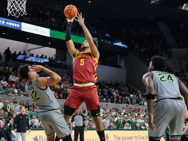 WACO, CA - JANUARY 07: Forward Joshua Jefferson #5 of the Iowa State Cyclones takes a shot over guard Michael Rataj #12 of the Baylor Bears during the Big 12 college basketball game between Baylor Bears and Iowa State Cyclones on January 7, 2026, at Foster Pavilion in Waco, TX.