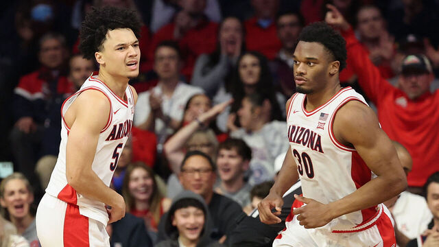 TUCSON, ARIZONA - JANUARY 07: Brayden Burries #5 (L) of the Arizona Wildcats reacts after scoring against the Kansas State Wildcats during the second half of the NCAAB game at McKale Center on January 07, 2026 in Tucson, Arizona.