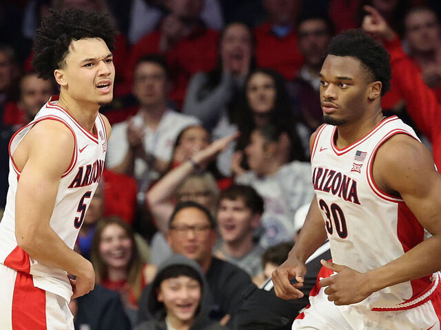 TUCSON, ARIZONA - JANUARY 07: Brayden Burries #5 (L) of the Arizona Wildcats reacts after scoring against the Kansas State Wildcats during the second half of the NCAAB game at McKale Center on January 07, 2026 in Tucson, Arizona.