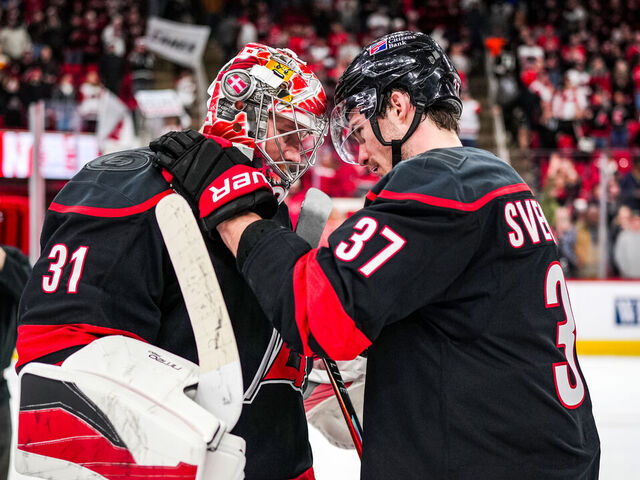 RALEIGH, NORTH CAROLINA - JANUARY 08: Frederik Andersen #31 of the Carolina Hurricanes celebrates with Andrei Svechnikov #37 after a victory against the Anaheim Ducks at Lenovo Center on January 08, 2026 in Raleigh, North Carolina.