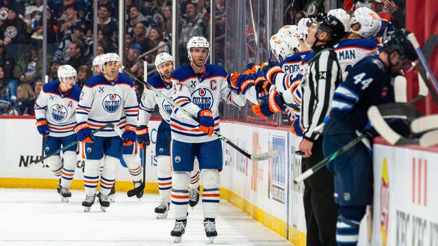 WINNIPEG, CANADA - JANUARY 8: Connor McDavid #97 of the Edmonton Oilers celebrates his goal with teammates in the second period against the Winnipeg Jets at Canada Life Centre on January 8, 2026 in Winnipeg, Canada.