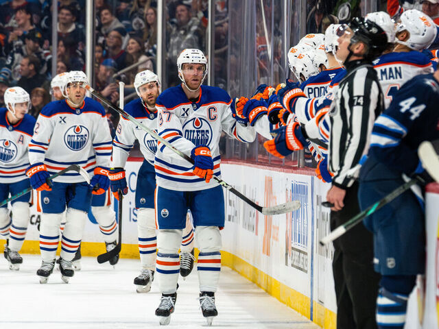 WINNIPEG, CANADA - JANUARY 8: Connor McDavid #97 of the Edmonton Oilers celebrates his goal with teammates in the second period against the Winnipeg Jets at Canada Life Centre on January 8, 2026 in Winnipeg, Canada.