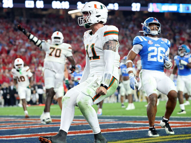 GLENDALE, ARIZONA - JANUARY 08: Carson Beck #11 of the Miami Hurricanes celebrates a touchdown against the Ole Miss Rebels in the fourth quarter during the 2025 College Football Playoff Semifinal at the VRBO Fiesta Bowl at State Farm Stadium on January 08, 2026 in Glendale, Arizona. The Hurricanes defeated the Rebels 31-27.