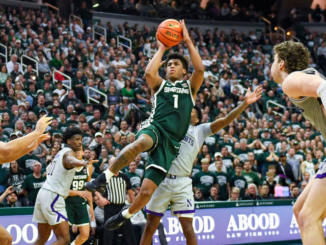 EAST LANSING, MICHIGAN - JANUARY 08: Jeremy Fears Jr. #1 of the Michigan State Spartans attempts a shot in front of Jayden Reid #4, Tre Singleton #8, and Max Green #10 of the Northwestern Wildcats during the second half of the college basketball game at Breslin Center on January 08, 2026 in East Lansing, Michigan. The Michigan State Spartans won the game 76-66.
