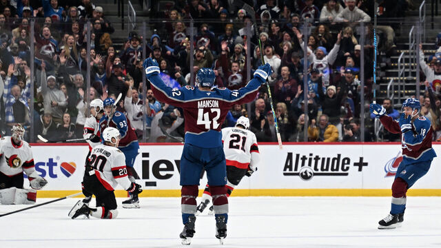 DENVER, CO- JANUARY 8: Colorado Avalanche defenseman Josh Manson (42) throws his arms into the air in celebration after scoring a goal during the second period as the Colorado Avalanche take on the Ottawa Senators at Ball Arena in Denver, Colorado on January 8, 2026.