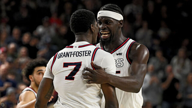 SPOKANE, WASHINGTON - JANUARY 02: Graham Ike #15 and Tyon Grant-Foster #7 of the Gonzaga Bulldogs celebrate a defensive turnover during overtime at McCarthey Athletic Center on January 02, 2026 in Spokane, Washington.