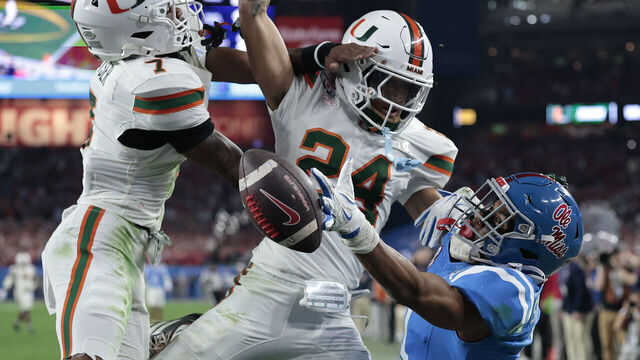 GLENDALE, ARIZONA - JANUARY 08: De'zhaun Stribling #1 of the Ole Miss Rebels reaches for an incomplete pass in the end zone in front of Ethan O'Connor #24 of the Miami Hurricanes in the final seconds of the fourth quarter at State Farm Stadium on January 08, 2026 in Glendale, Arizona.