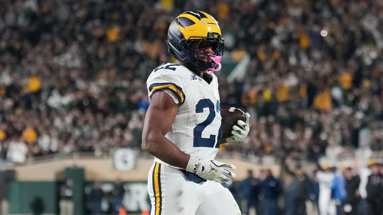 EAST LANSING, MICHIGAN - OCTOBER 25: Justice Haynes #22 of the Michigan Wolverines runs in action to score a touchdown against the Michigan State Spartans during the third quarter at Spartan Stadium on October 25, 2025 in East Lansing, Michigan.